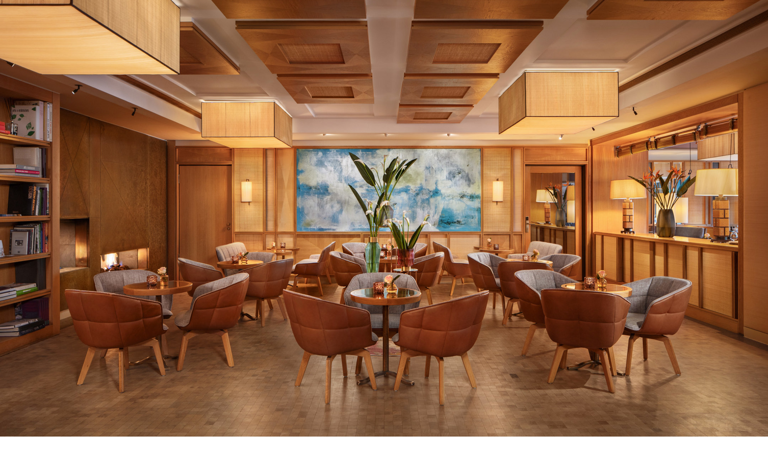 A cosy seating area in the lobby with warm lighting and wooden accents.